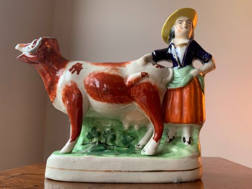 ANTIQUE STAFFORDSHIRE POTTERY COW AND MILKMAID FIGURE CREAMER JUG 19TH CENTURY - ADDITIONAL PHOTO 1