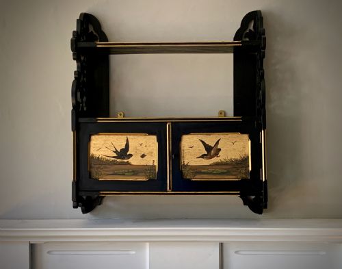 aesthetic movement ebonised wall cabinet with gilded panels painted with birds - CATEGORY: ANTIQUE CABINETS - DATED 19TH CENTURY