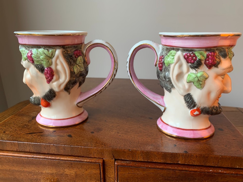 A set of four Victorian Staffordshire ceramic wine cups moulded in the form of bearded satyr faces with grapevine crowns and pink gilded rims. View VIII