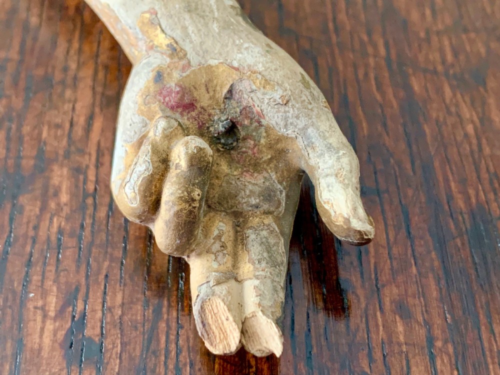A 16th-century hand-carved lime wood Corpus Christi sculpture displaying remnant polychrome paint and gilding. View VII