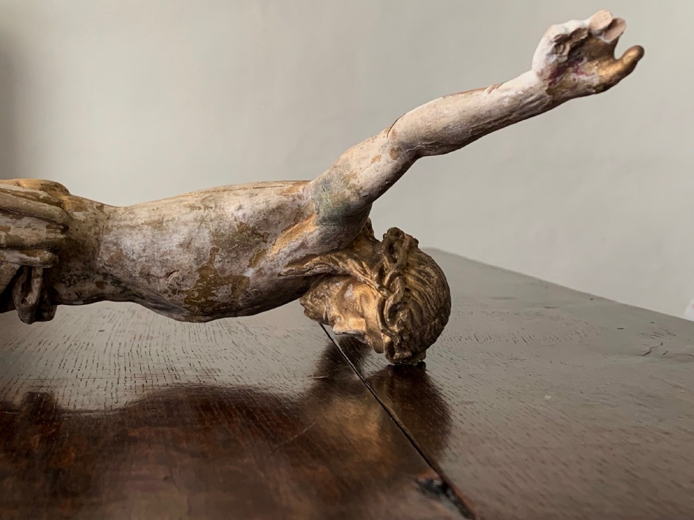 A 16th-century hand-carved lime wood Corpus Christi sculpture displaying remnant polychrome paint and gilding. View XIV