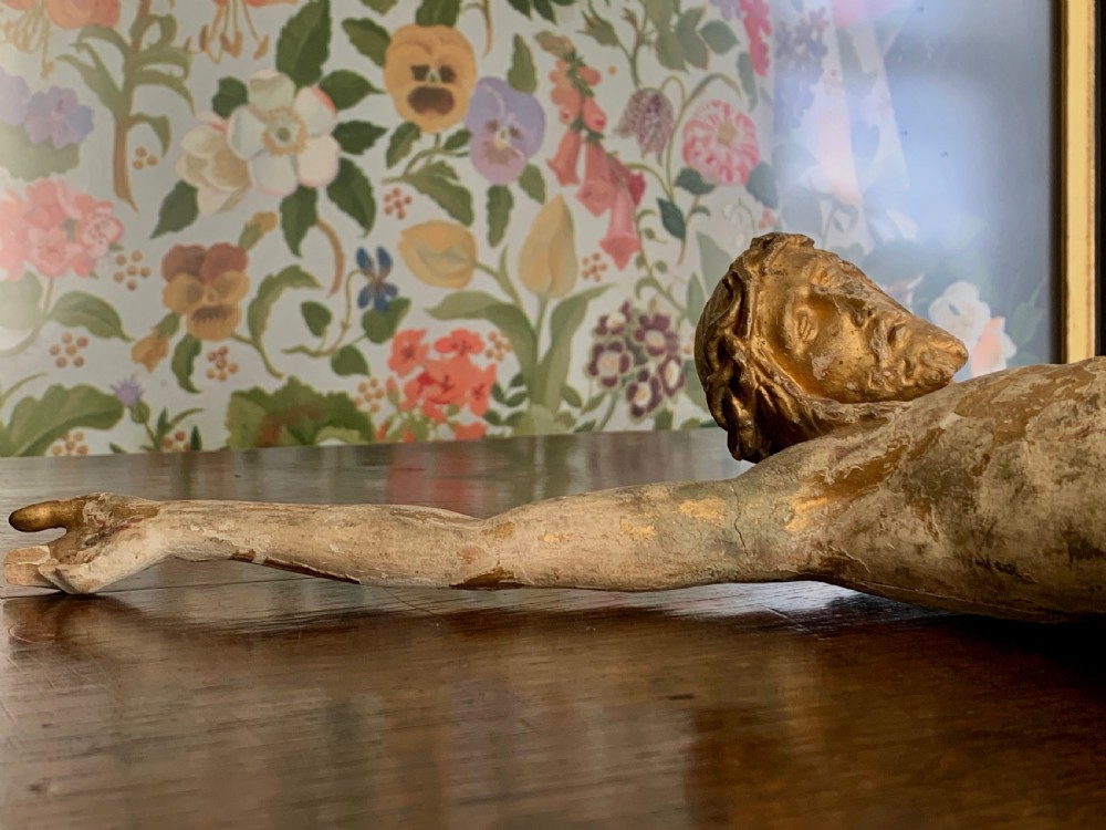 A 16th-century hand-carved lime wood Corpus Christi sculpture displaying remnant polychrome paint and gilding. View XVI