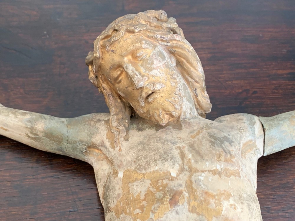 A 16th-century hand-carved lime wood Corpus Christi sculpture displaying remnant polychrome paint and gilding. View XX