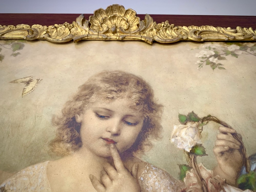 A horizontal Victorian print depicting three children in a garden setting, enclosed in a gilded Rococo-style inner frame set within a polished mahogany outer border. View IV
