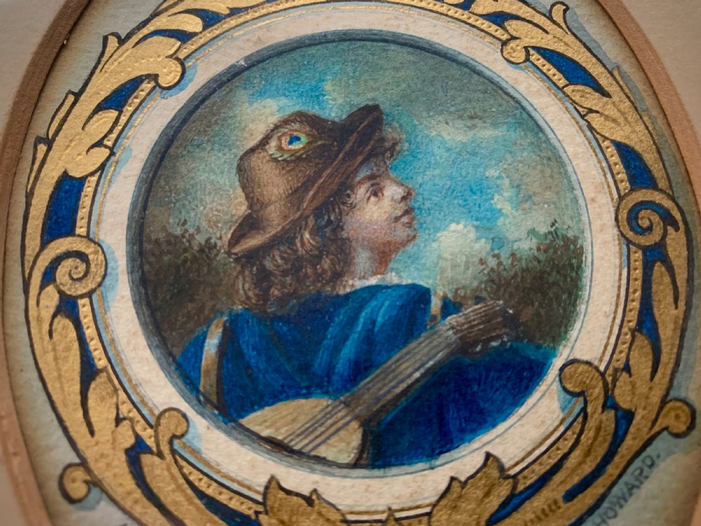 An oval framed miniature watercolour painting depicting a travelling musician wearing a blue tunic and feathered hat, surrounded by an ornate gilded and blue cartouche border. View II
