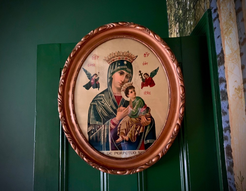 An oval gilt-framed Victorian print depicting the Virgin Mary holding the Christ Child flanked by angels in Byzantine iconographic style. View II