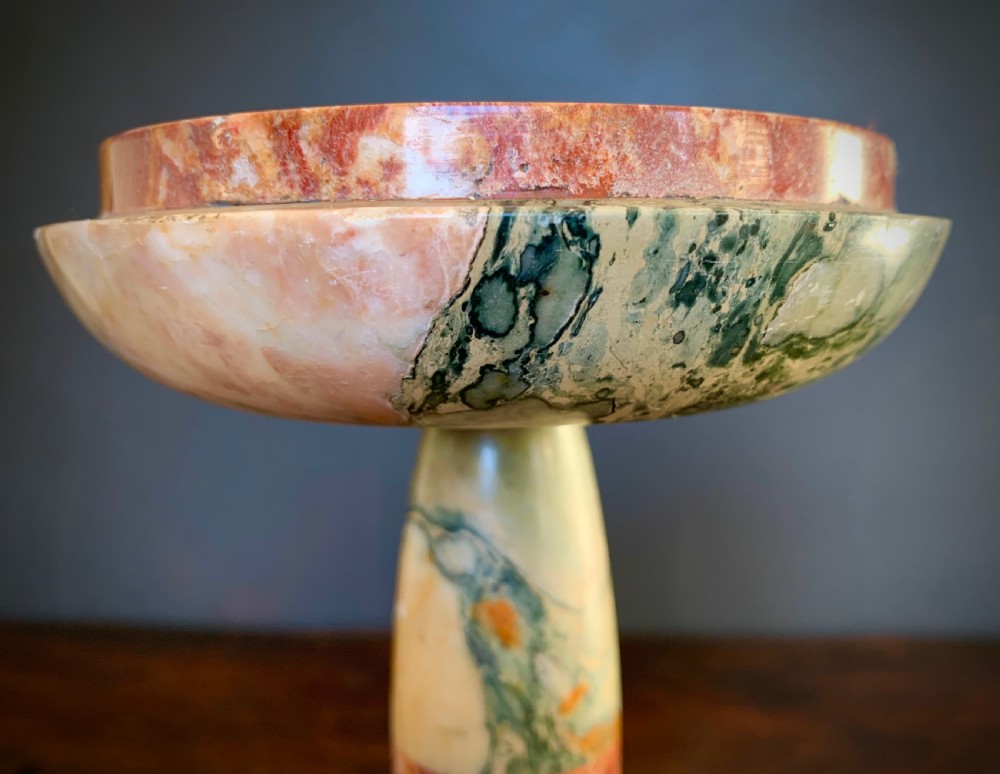 A pair of turned, variegated marble tazzas featuring shallow circular dishes raised on baluster stems and round bases in shades of red, green, and tan. View IV