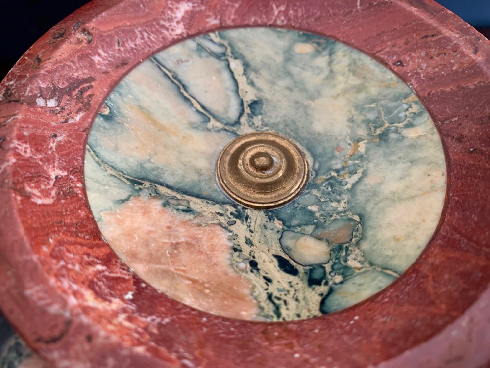 A pair of turned, variegated marble tazzas featuring shallow circular dishes raised on baluster stems and round bases in shades of red, green, and tan. View XIII
