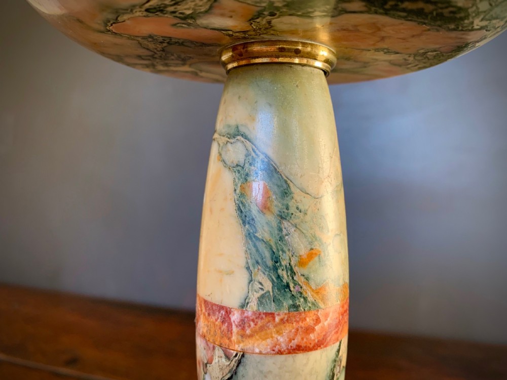A pair of turned, variegated marble tazzas featuring shallow circular dishes raised on baluster stems and round bases in shades of red, green, and tan. View XIV