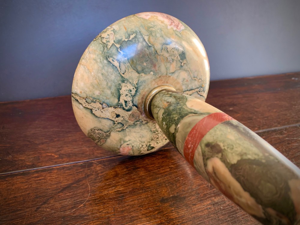 A pair of turned, variegated marble tazzas featuring shallow circular dishes raised on baluster stems and round bases in shades of red, green, and tan. View XVI