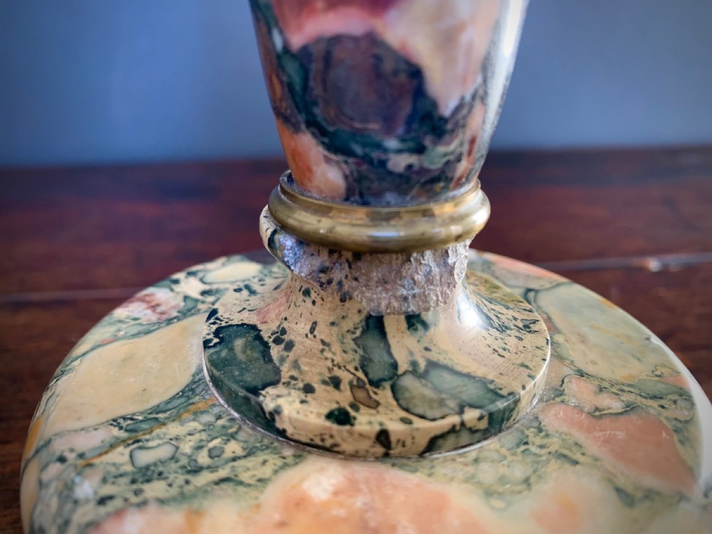 A pair of turned, variegated marble tazzas featuring shallow circular dishes raised on baluster stems and round bases in shades of red, green, and tan. View XVII