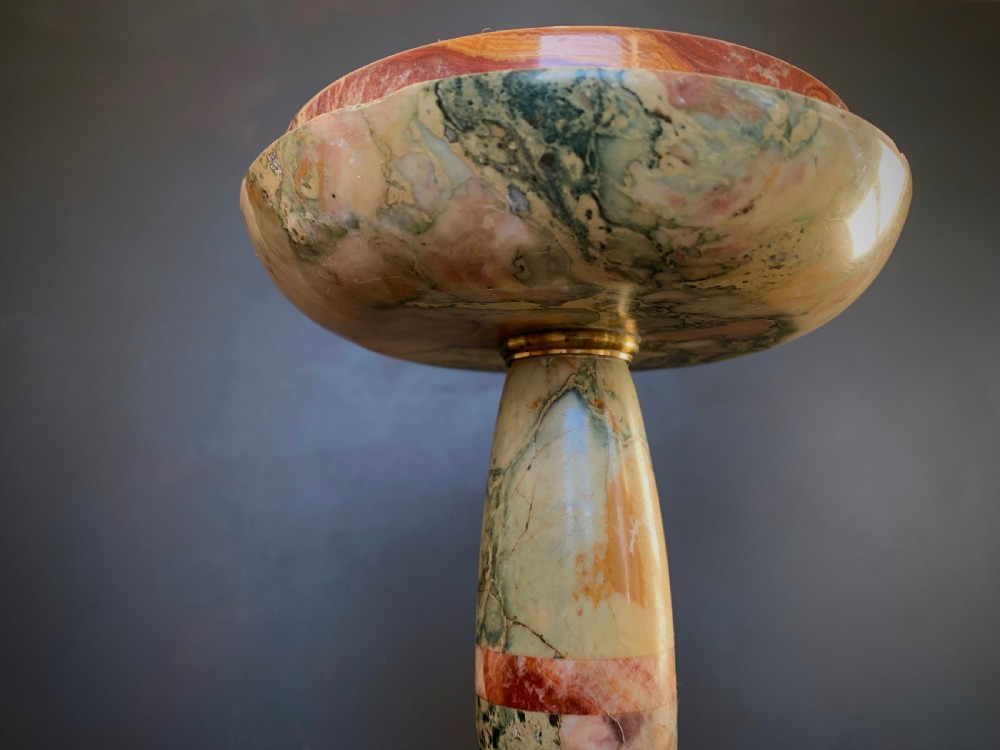 A pair of turned, variegated marble tazzas featuring shallow circular dishes raised on baluster stems and round bases in shades of red, green, and tan. View XXII