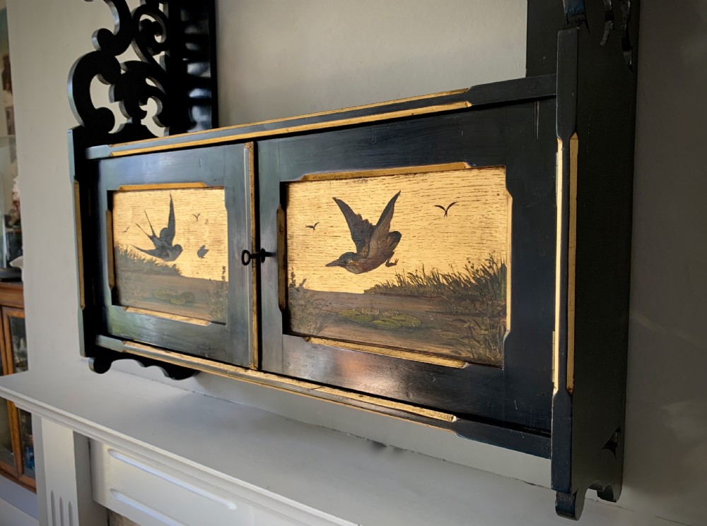 AESTHETIC MOVEMENT EBONISED WALL CABINET WITH GILDED PANELS PAINTED WITH BIRDS. View X