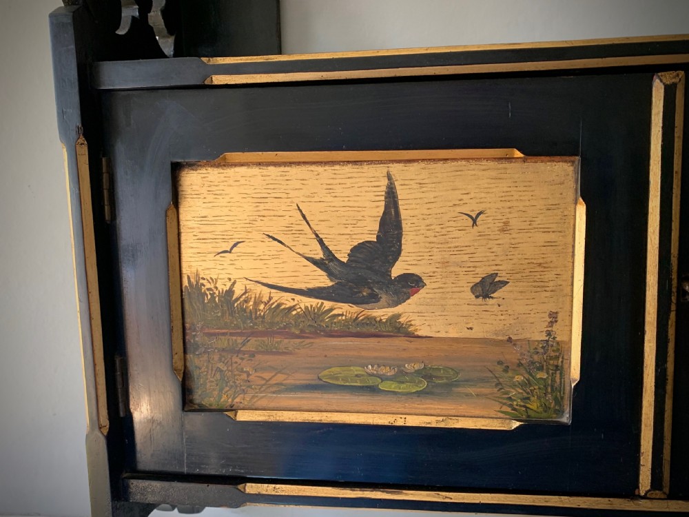 AESTHETIC MOVEMENT EBONISED WALL CABINET WITH GILDED PANELS PAINTED WITH BIRDS. View XIV