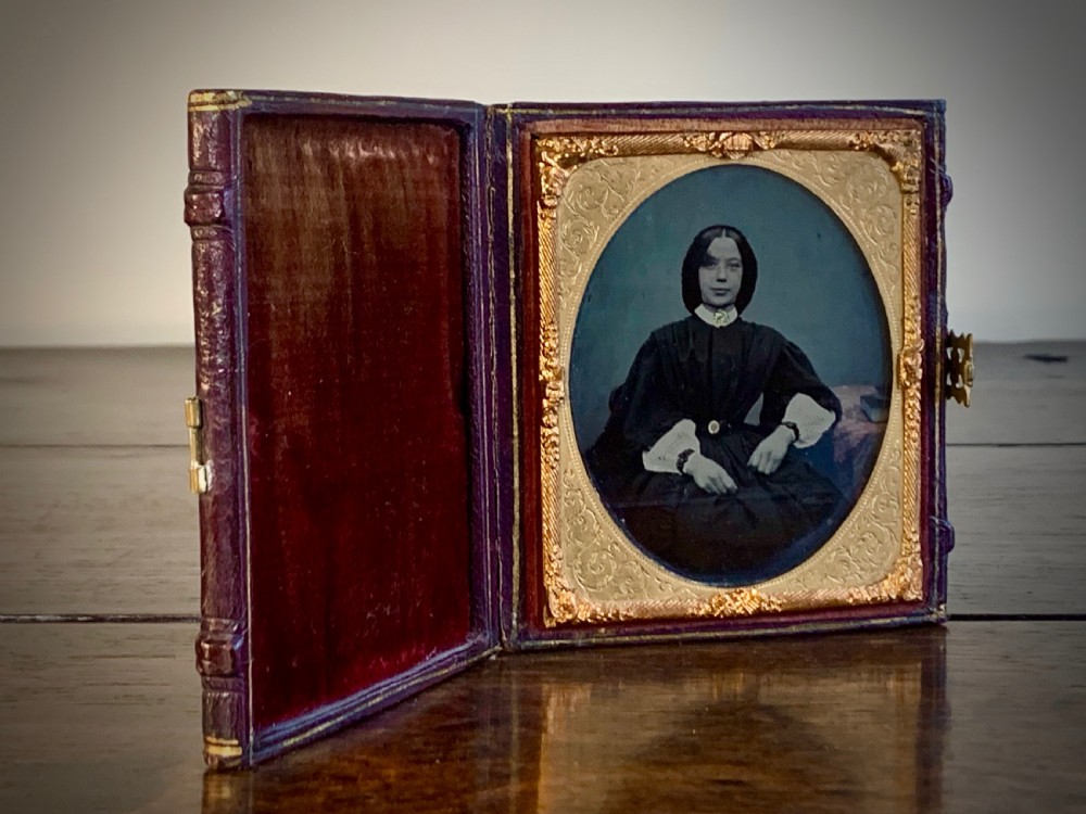 LEATHER CASED PICTURE FRAME  WITH AMBROTYPE PHOTOGRAPH - 19TH CENTURY.