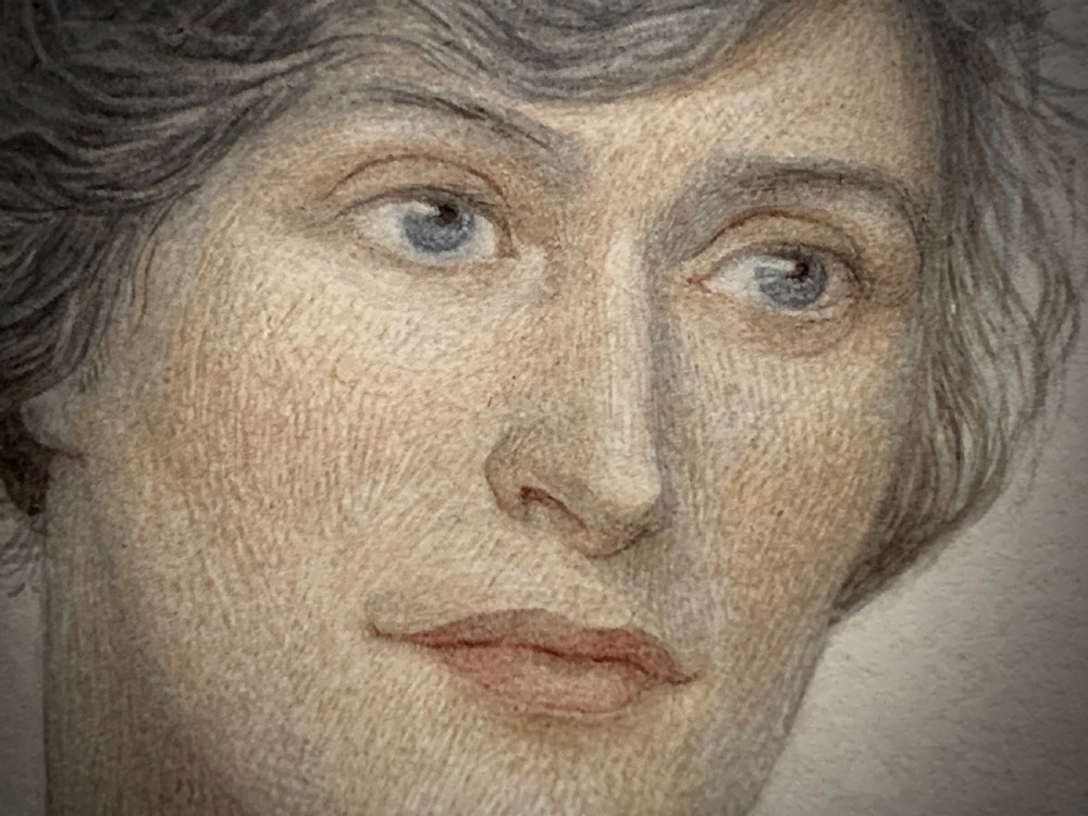 A framed 1928 watercolour painting of a young woman with short dark hair, wearing a blue jacket and shawl, set within a wide gold mount and ornate gilded frame. View V