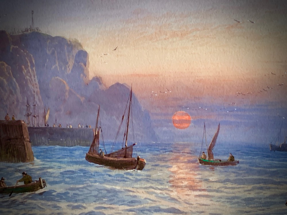A horizontal Victorian watercolour painting depicting sailing boats in a coastal harbour at sunset, set within a wide gilded frame. View IV