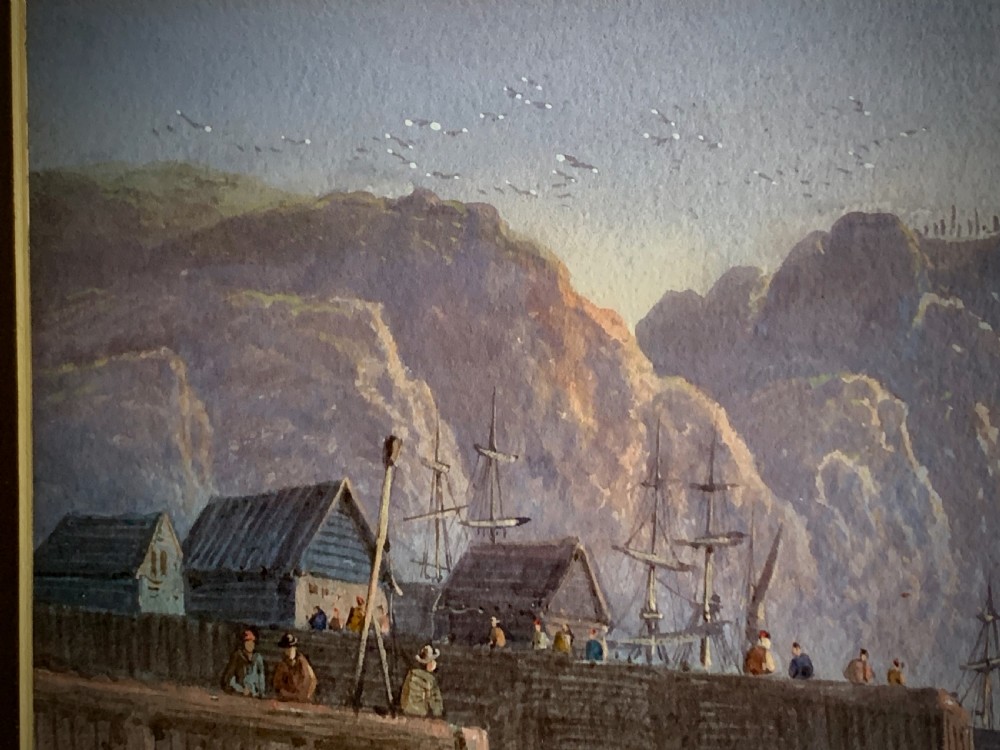 A horizontal Victorian watercolour painting depicting sailing boats in a coastal harbour at sunset, set within a wide gilded frame. View X