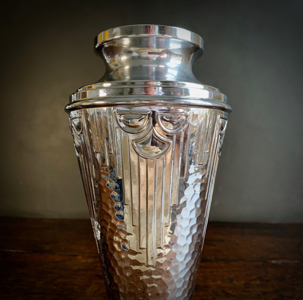 A pair of Art Deco chrome-plated metal vases with hammered lower bodies, geometric moulding near the rim, and circular stepped bases. View III