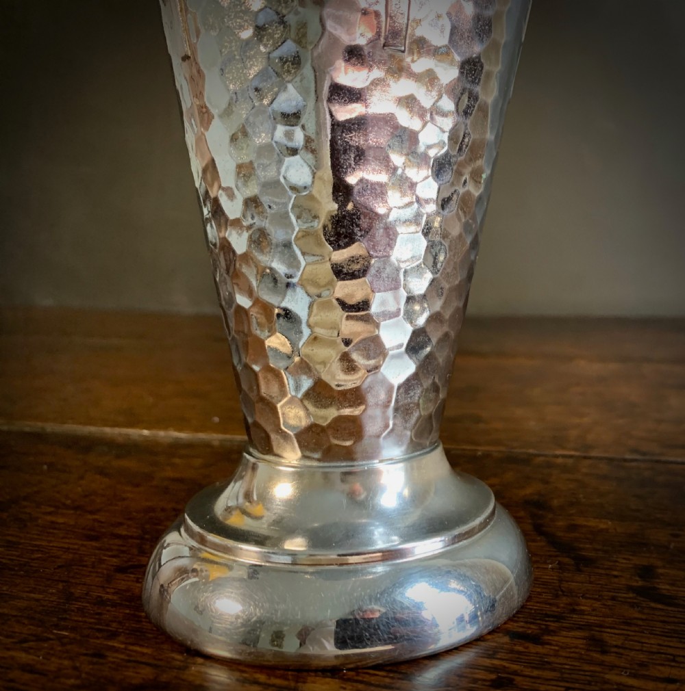 A pair of Art Deco chrome-plated metal vases with hammered lower bodies, geometric moulding near the rim, and circular stepped bases. View XIX