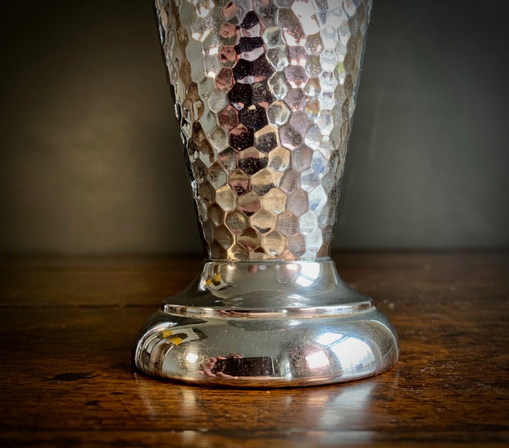 A pair of Art Deco chrome-plated metal vases with hammered lower bodies, geometric moulding near the rim, and circular stepped bases. View XX
