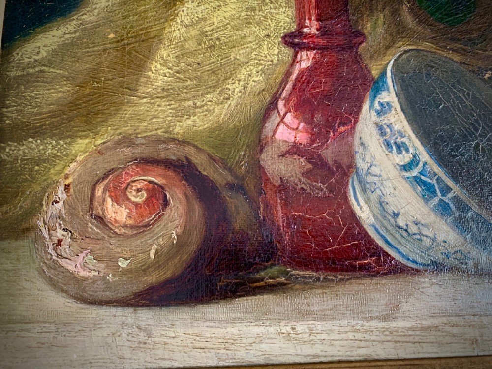 A 19th-century framed oil painting depicting a seashell, a red glass bottle, and a porcelain bowl set against draped fabric. View VII
