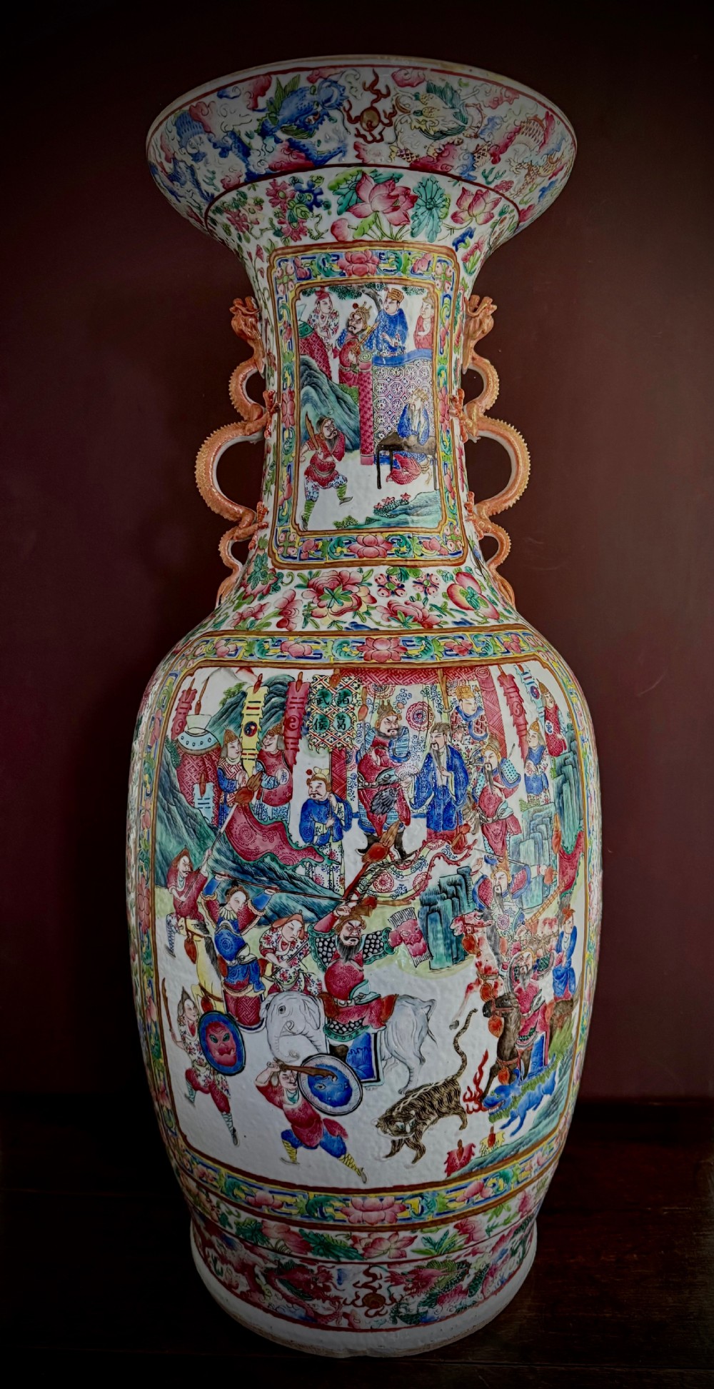 A large 19th-century Cantonese porcelain floor vase decorated with polychrome enamel court scenes, floral borders, and gilded dragon handles. View III