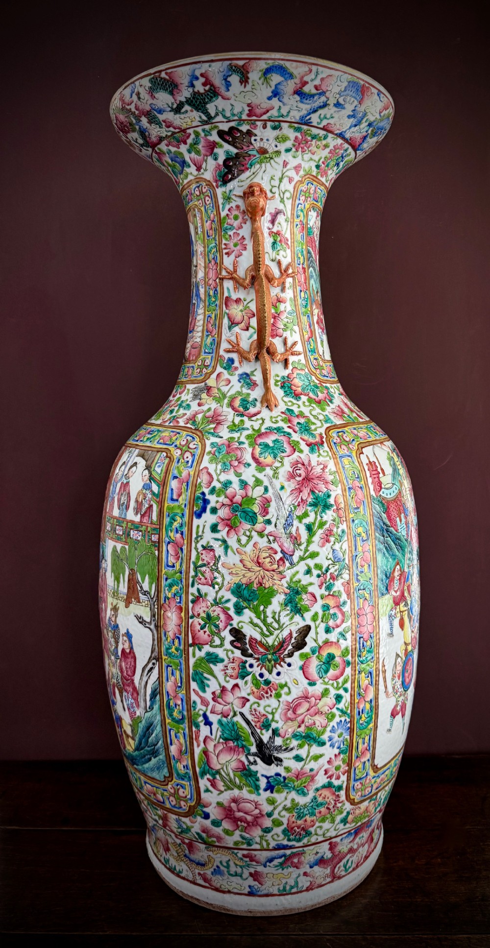 A large 19th-century Cantonese porcelain floor vase decorated with polychrome enamel court scenes, floral borders, and gilded dragon handles. View VI