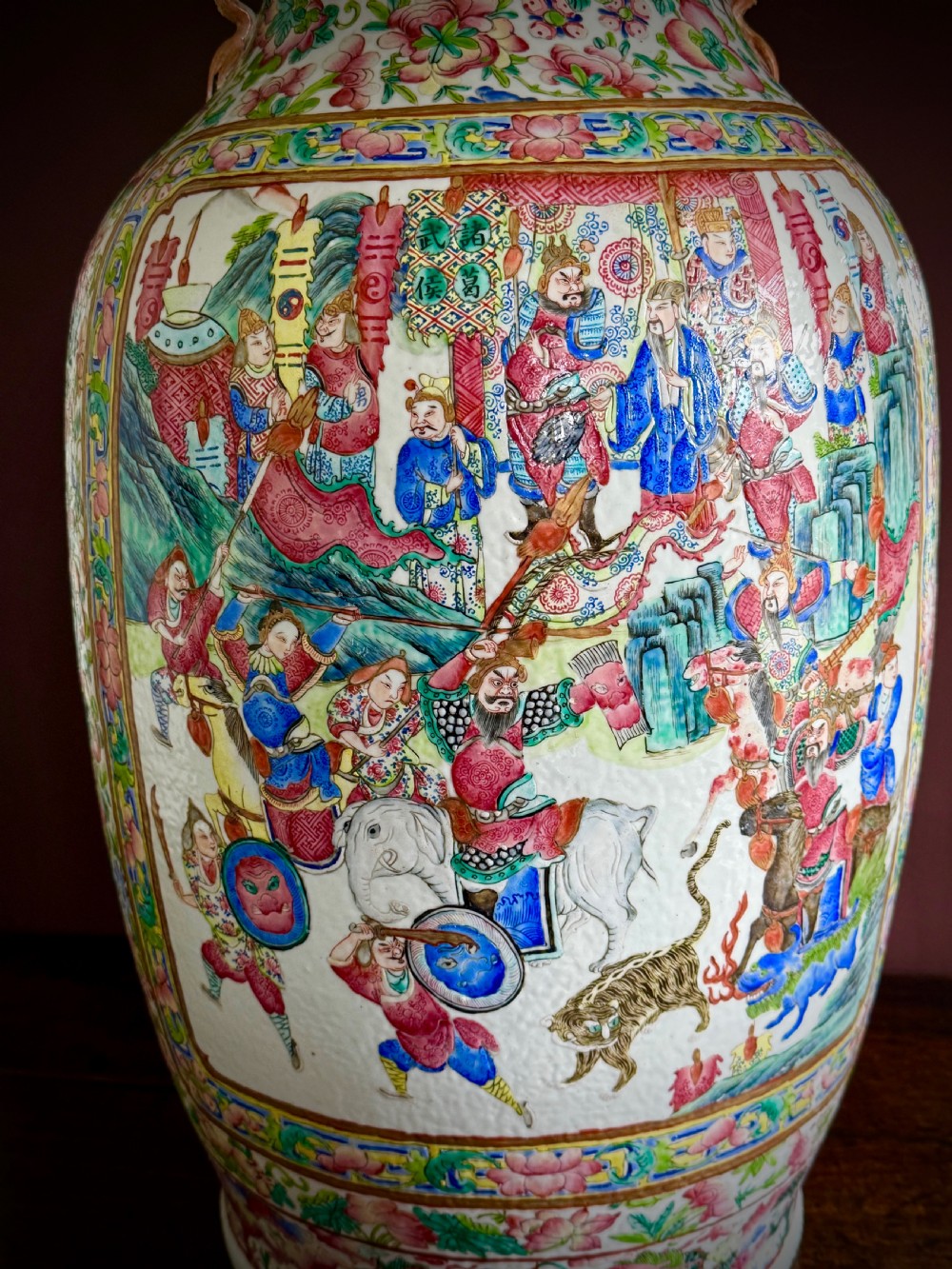A large 19th-century Cantonese porcelain floor vase decorated with polychrome enamel court scenes, floral borders, and gilded dragon handles. View VII