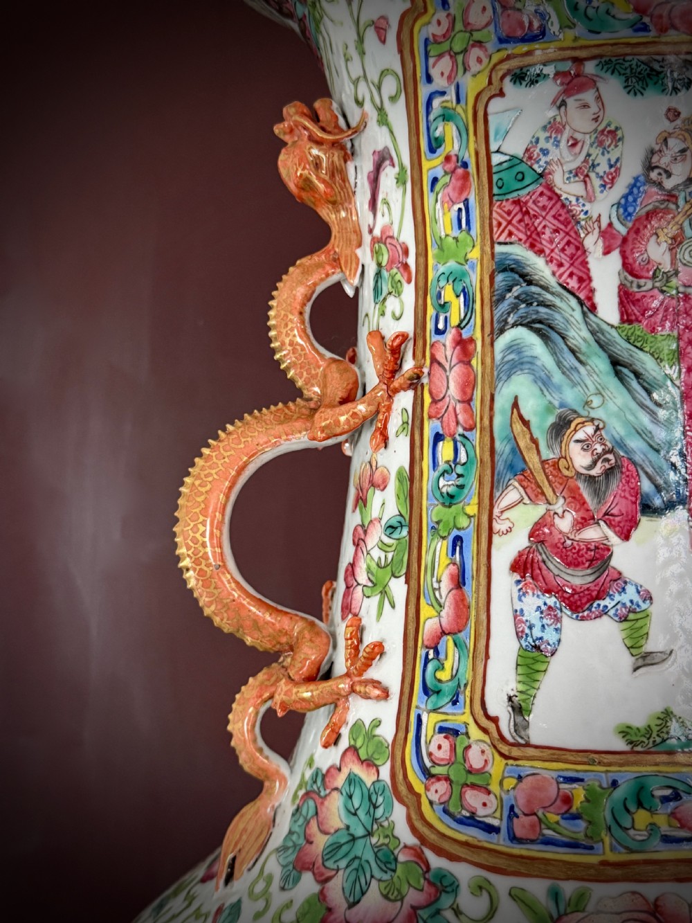 A large 19th-century Cantonese porcelain floor vase decorated with polychrome enamel court scenes, floral borders, and gilded dragon handles. View IX
