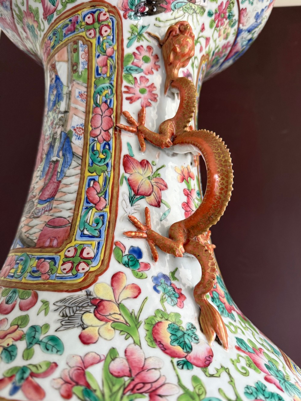 A large 19th-century Cantonese porcelain floor vase decorated with polychrome enamel court scenes, floral borders, and gilded dragon handles. View XXV