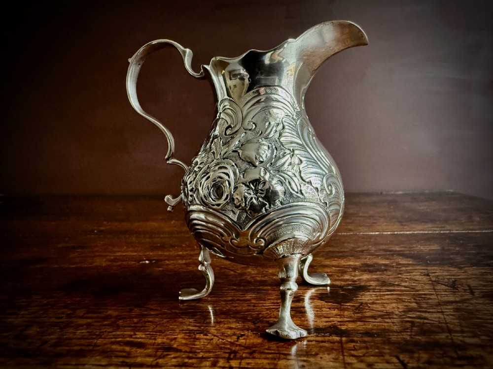 GEORGE II STIRLING SILVER THREE FOOTED CREAM JUG by GEORGE CAMPAR OF LONDON - 1755