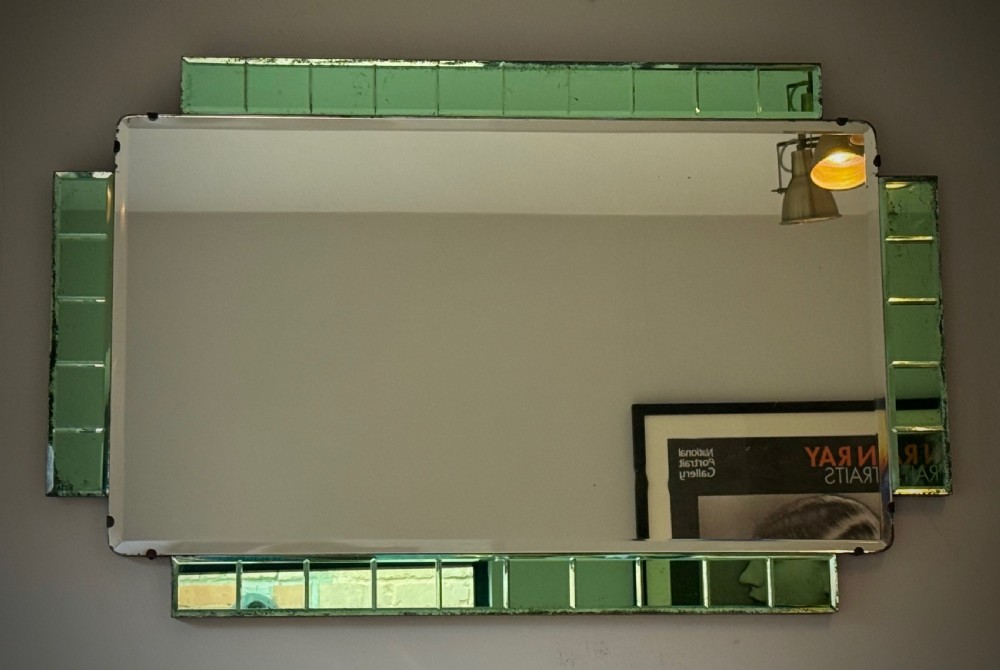 A rectangular Art Deco wall mirror featuring a central bevelled glass plate flanked by stepped emerald green tiled glass borders. View IV