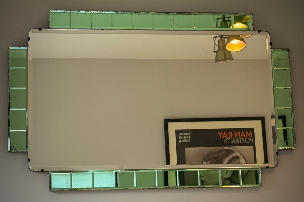 A rectangular Art Deco wall mirror featuring a central bevelled glass plate flanked by stepped emerald green tiled glass borders. View X