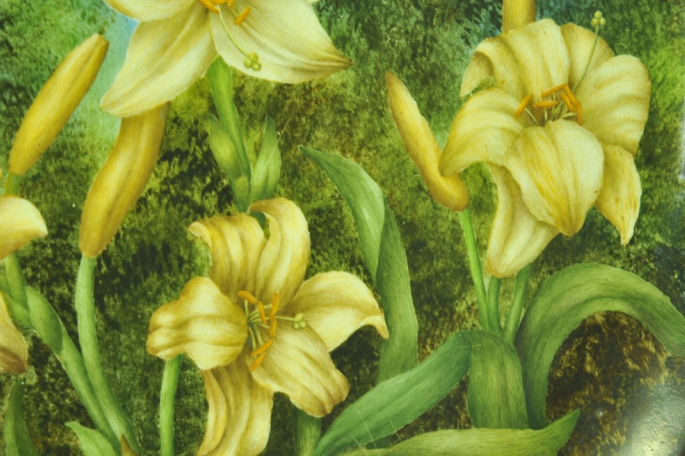 A circular hand-painted porcelain decorative plate displaying yellow lilies against foliage and a blue sky. View VIII