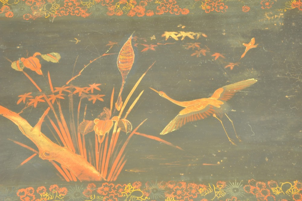 A late Victorian two-tier bamboo side table featuring a dark lacquered top panel decorated with botanical flora and birds. View XI
