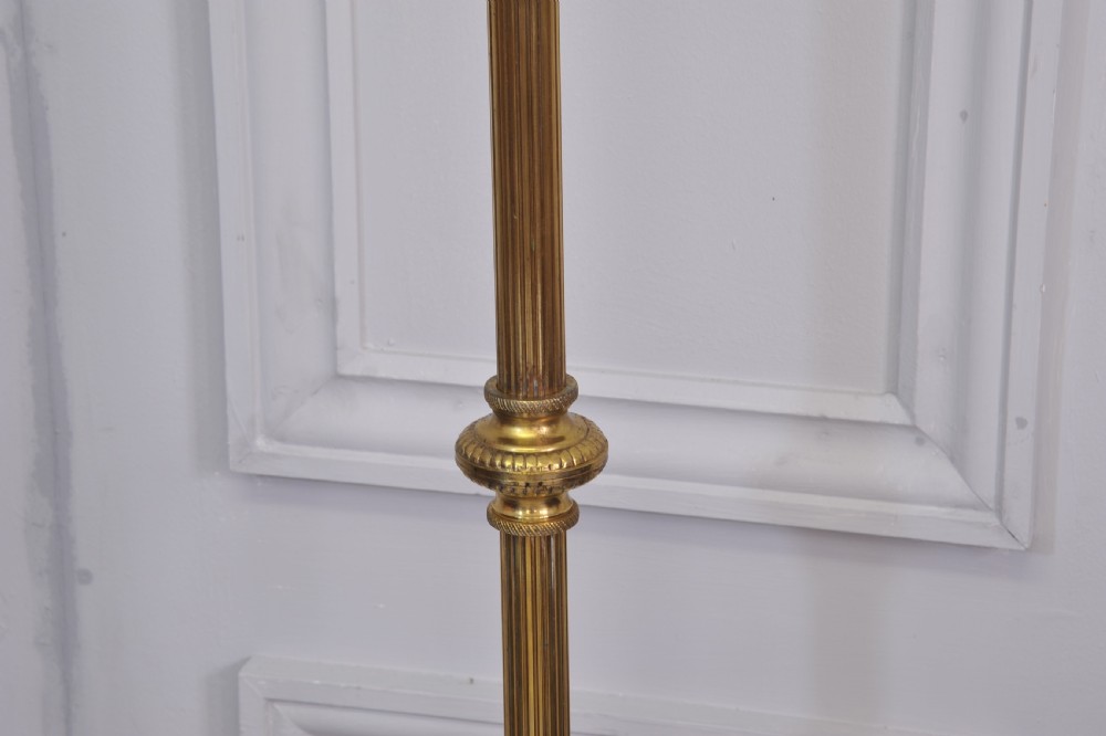 A brass French bouillotte style standard lamp featuring four fluted candle sockets with tulip glass shades and a central ring finial. View V