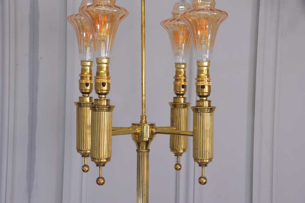 A brass French bouillotte style standard lamp featuring four fluted candle sockets with tulip glass shades and a central ring finial. View VI