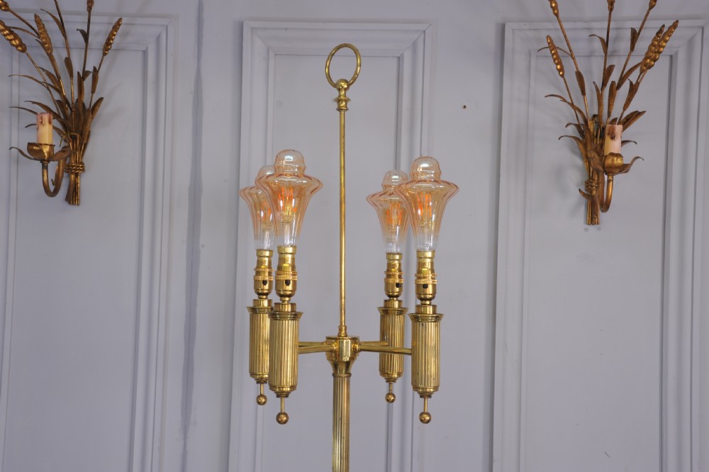 A brass French bouillotte style standard lamp featuring four fluted candle sockets with tulip glass shades and a central ring finial. View VII