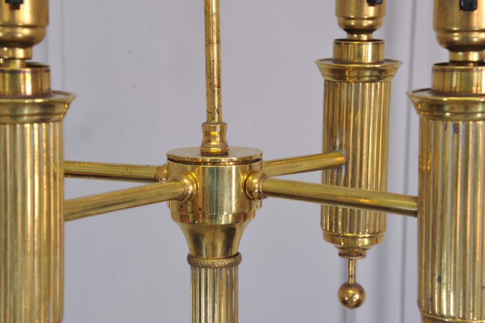 A brass French bouillotte style standard lamp featuring four fluted candle sockets with tulip glass shades and a central ring finial. View VIII