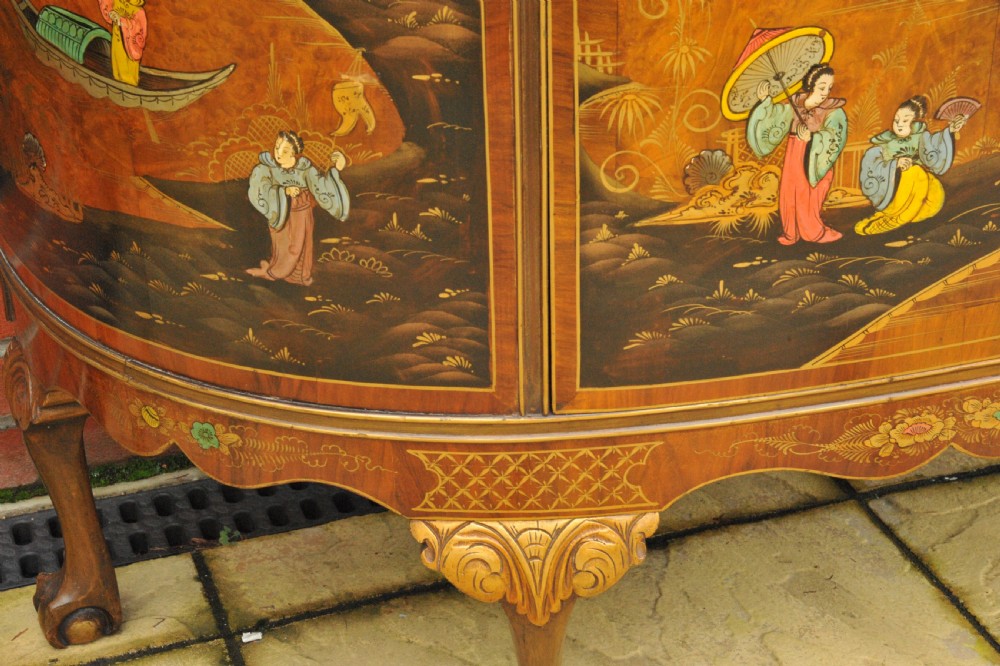 A circa 1910 semi-circular demi-lune cabinet featuring hand-painted Chinoiserie figures and landscapes with gilt details on cabriole legs. View III