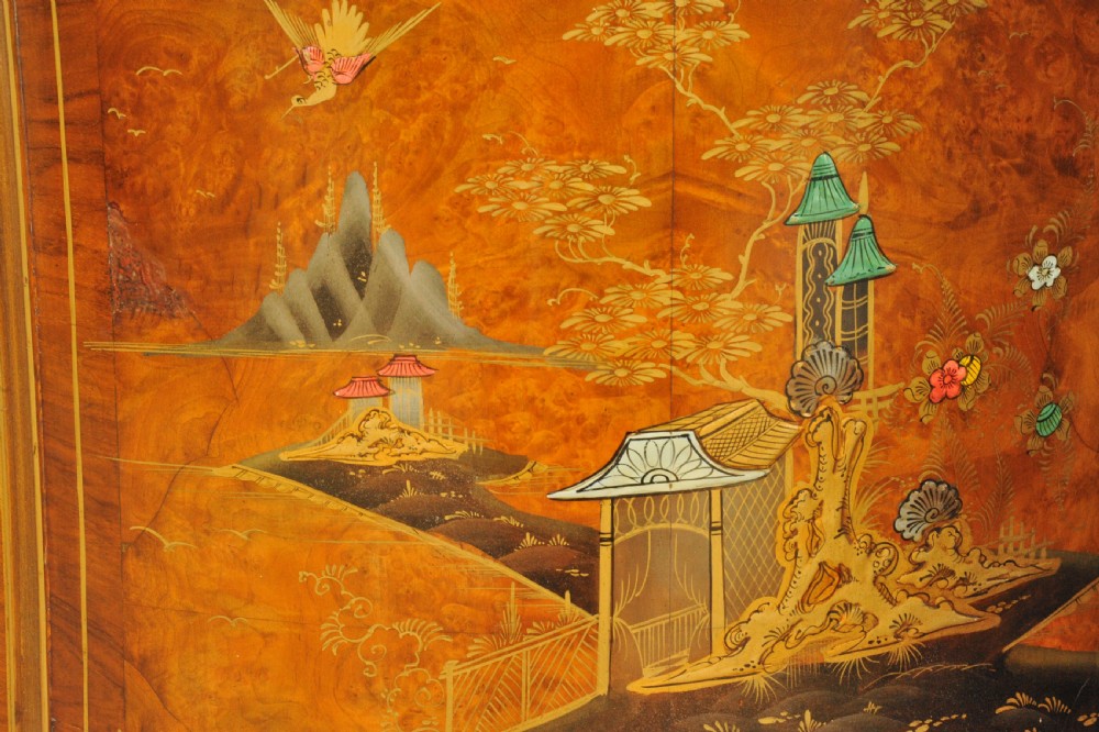 A circa 1910 semi-circular demi-lune cabinet featuring hand-painted Chinoiserie figures and landscapes with gilt details on cabriole legs. View IX