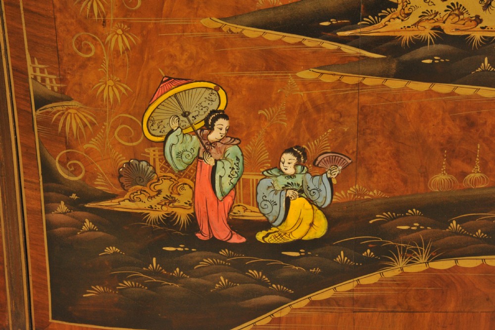 A circa 1910 semi-circular demi-lune cabinet featuring hand-painted Chinoiserie figures and landscapes with gilt details on cabriole legs. View XII