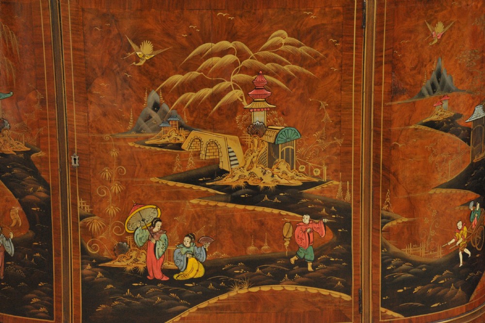 A circa 1910 semi-circular demi-lune cabinet featuring hand-painted Chinoiserie figures and landscapes with gilt details on cabriole legs. View XVI