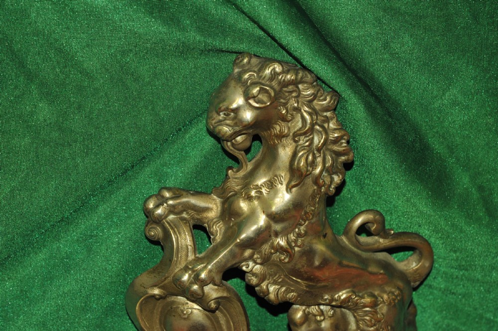 A cast brass Louis XV style fireplace fender featuring a central pierced lattice gallery flanked by two sculpted lions resting on shields. View XIII