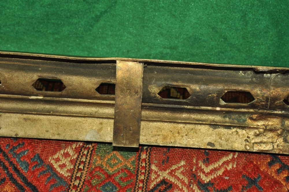 A cast brass Louis XV style fireplace fender featuring a central pierced lattice gallery flanked by two sculpted lions resting on shields. View XVI
