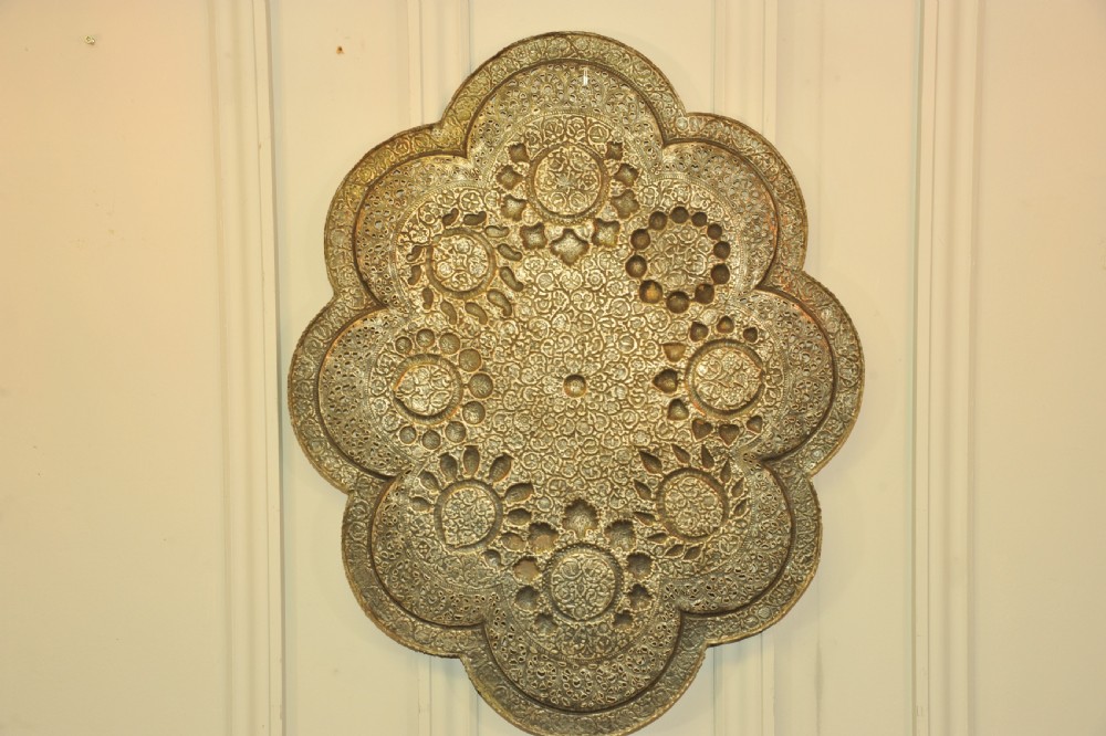 An antique Kashmiri lobed copper tray featuring detailed repousse floral work, pierced openwork sections, and residual silver plating. View XIII