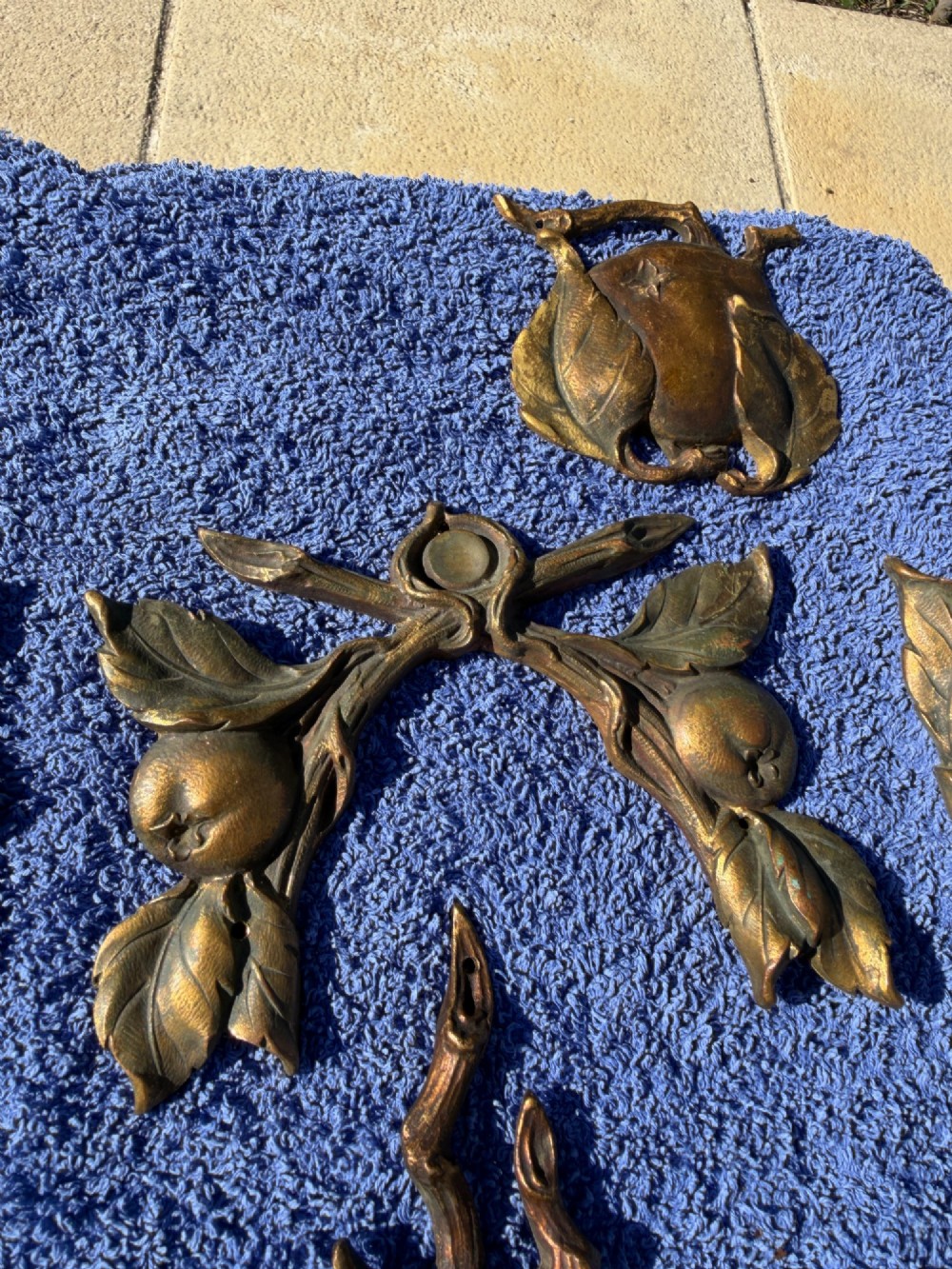 A close-up view of nineteenth-century gilt bronze appliques sculpted with apples, leaves, and branches in high relief. View IV