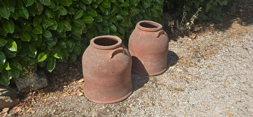 fig 1. A pair of large Victorian terracotta rhubarb forcers with side handles and an aged clay surface.