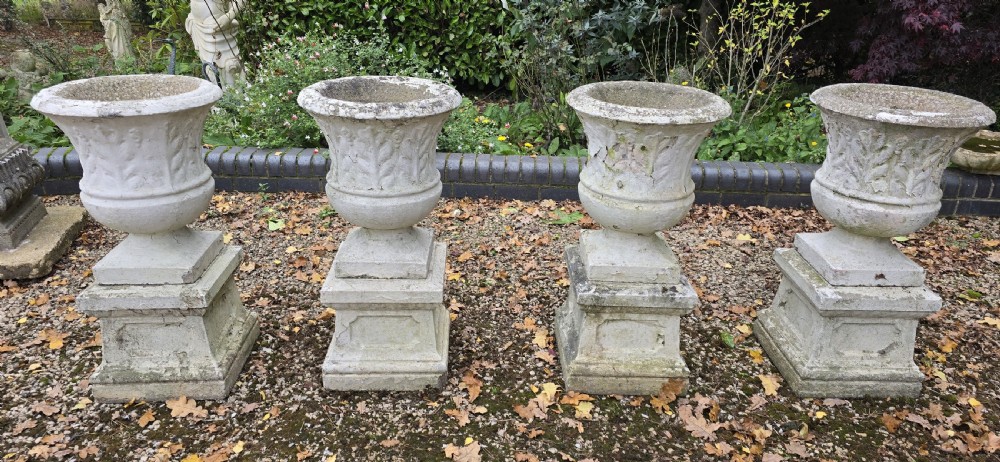 Set Four Stone Urns on Plinths View III